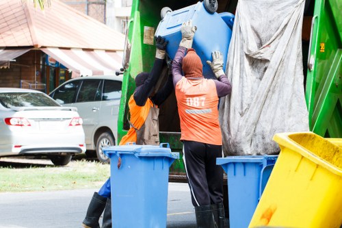 Team members sorting items during loft clearance